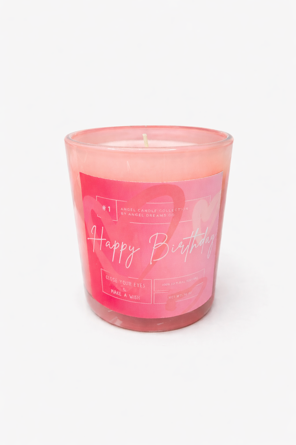 Pink candle in a glass jar with 'Happy Birthday' text on a white background
